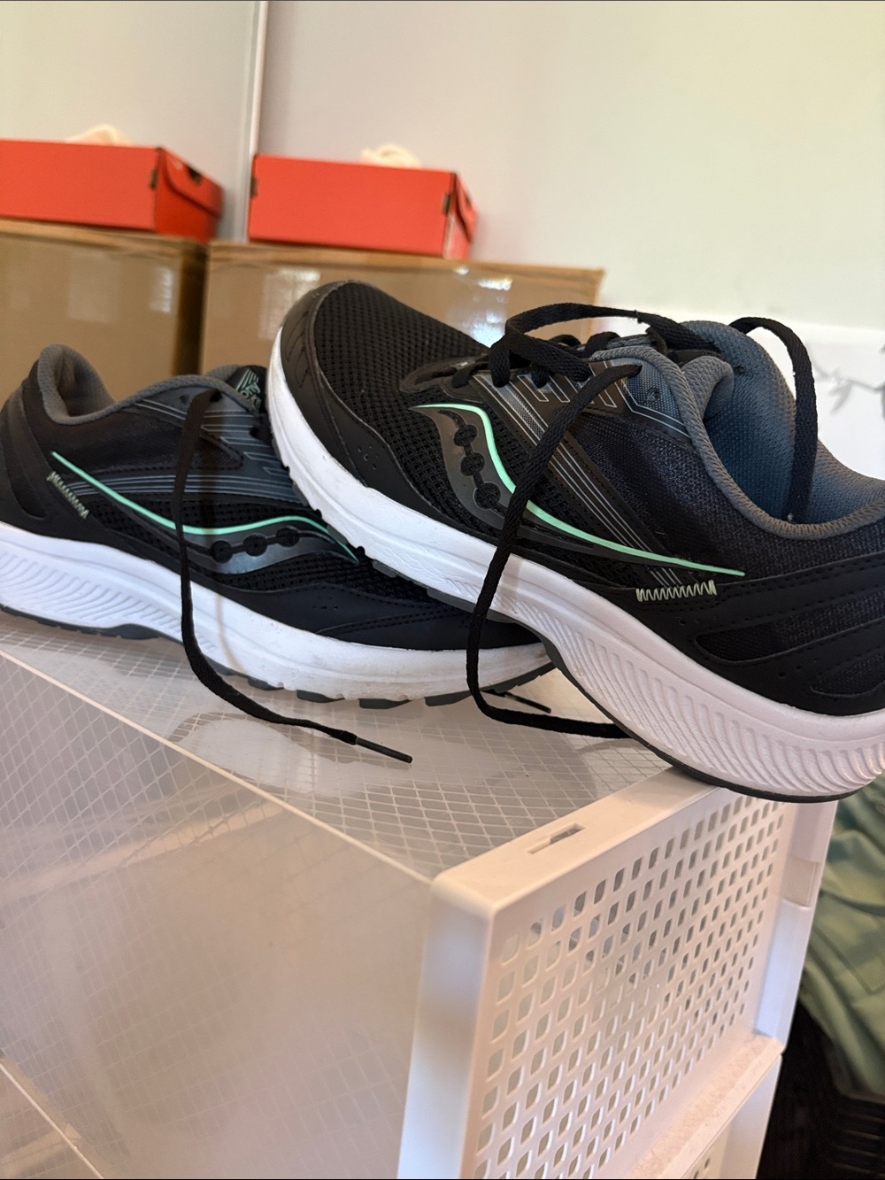 Saucony women’s Black Running Shoes with Mint Stripe